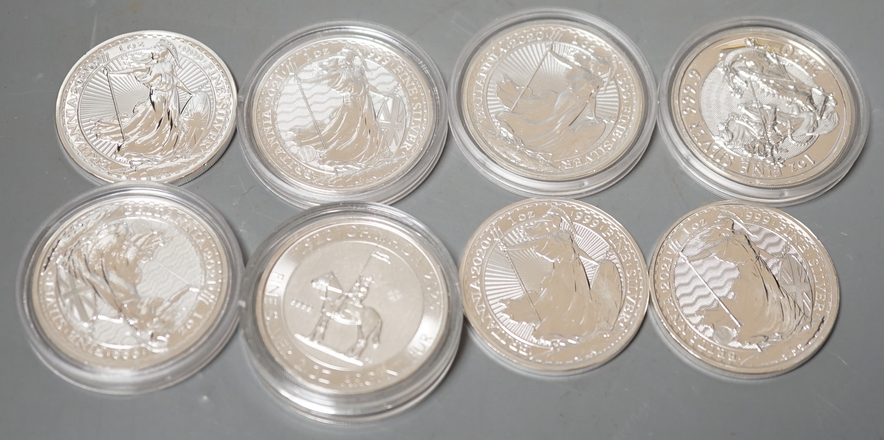 Seven UK Royal Mint silver bullion 1oz. Britannia coins and a Canada 2oz bullion silver 10$